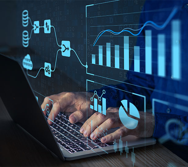 Man typing on laptop with graphs as the overlay